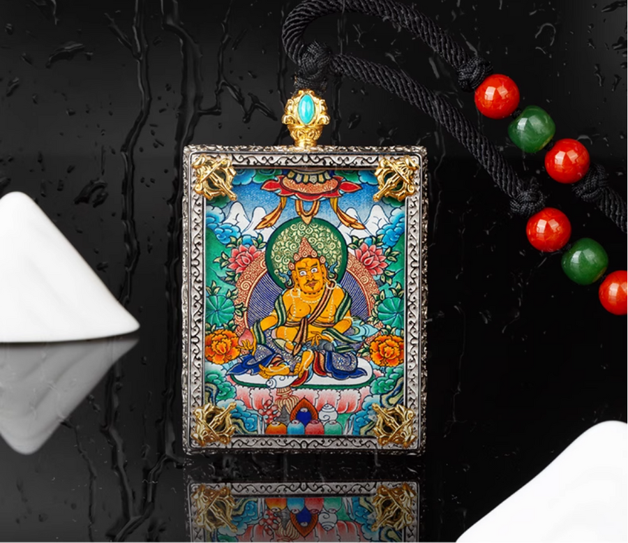 Colorful Thangka pendant with intricate design and beads on black background.