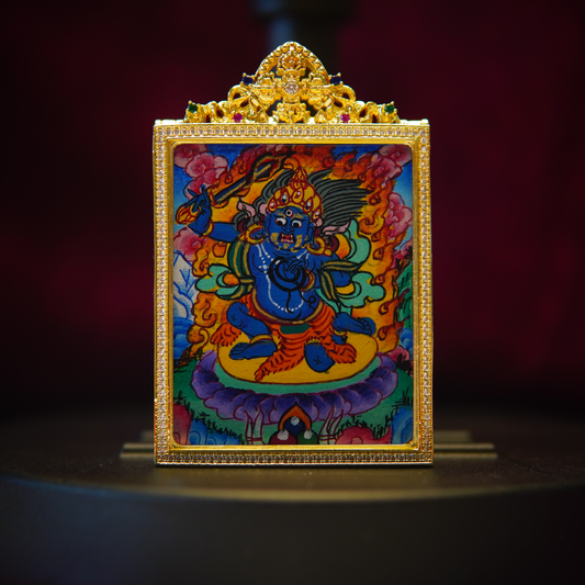 Hand-painted Acala necklace featuring fierce Buddhist wisdom king amulet with vivid cobalt-blue deity and sacred implements, crafted by Tibetan artisans.