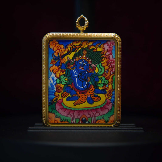 Acalanatha Vidyaraja Thangka Pendant with blue deity, crown of flames, gold-plated frame, and sacred imagery for strength and purification.
