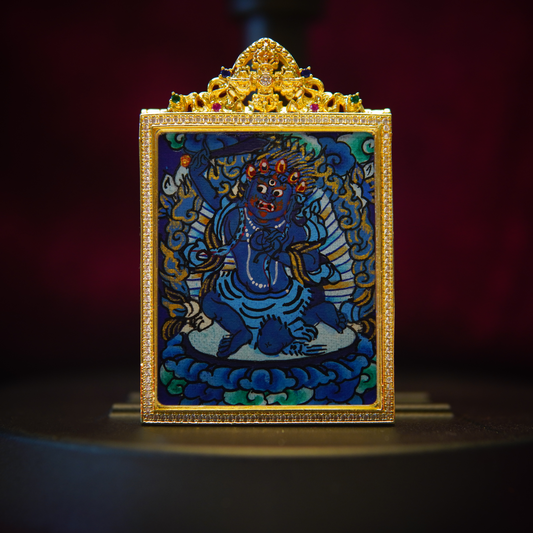 Acala Buddha Thangka necklace featuring a hand-painted blue deity with gold accents, encased in a gold-plated frame.