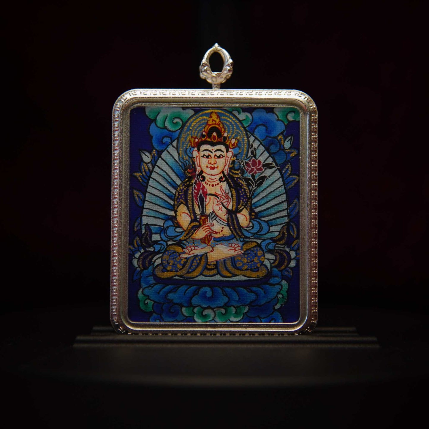 Akasagarbha Bodhisattva Thangka Pendant Necklace featuring hand-painted divine imagery of Bodhisattva with ornate adornments, surrounded by cosmic motifs, set in a silver-toned frame.
