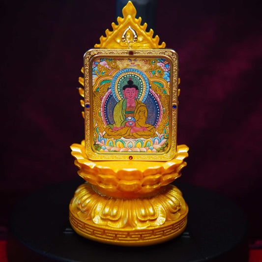 Golden lotus Thangka pendant display stand with glass cover and wooden base.