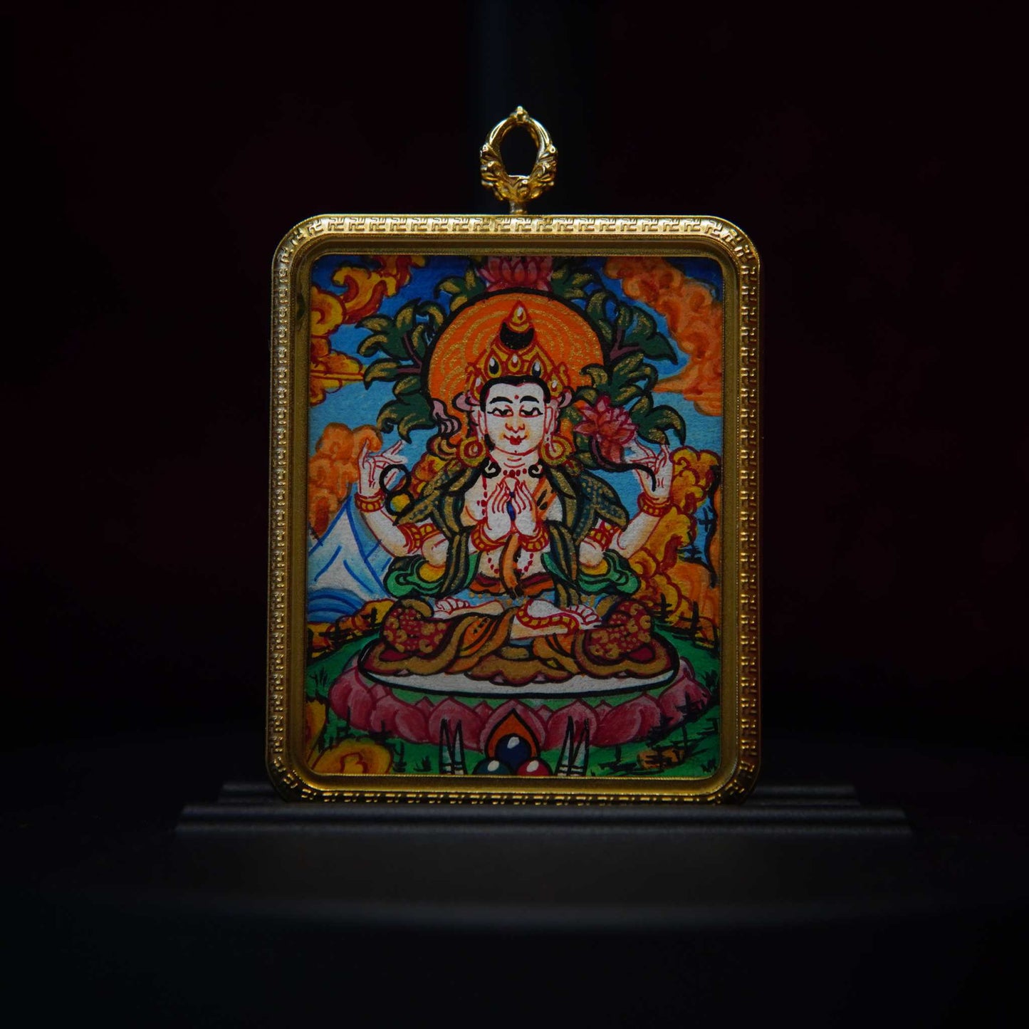 Hand-painted Four-Armed Avalokiteshvara necklace with Tibetan Buddhist pendant, symbolizing compassion and blessings.