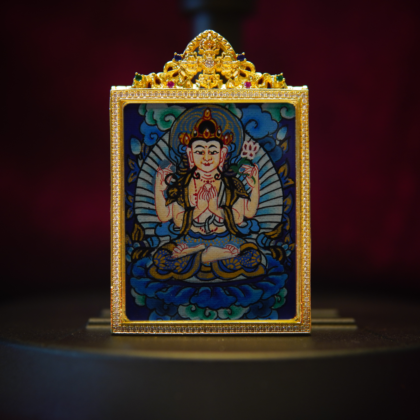 Four-Armed Avalokiteshvara Pendant Necklace featuring hand-painted Bodhisattva on gold-plated frame.