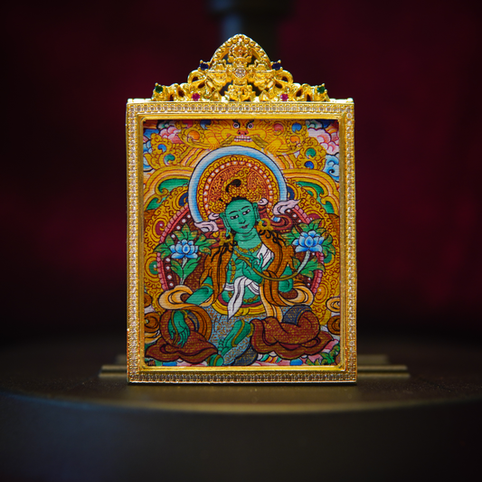 Authentic Green Buddha Goddess Necklace showcasing the Green Tara in a hand-painted Tibetan thangka with intricate gold detailing, symbolizing feminine empowerment and emotional healing.