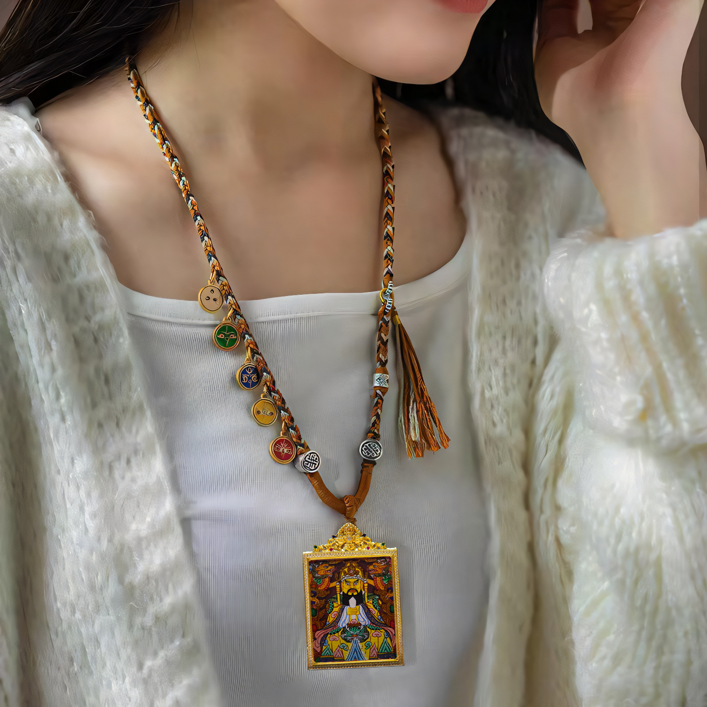 Hand-painted Dragon King Bodhisattva Thangka pendant, Tibetan Buddhist amulet for wealth and protection, worn on a braided necklace with decorative beads.