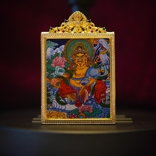 Yellow Jambhala Thangka Pendant, hand-painted, symbol of fortune and prosperity, adorned with jewels, on a lotus throne with a vibrant halo.