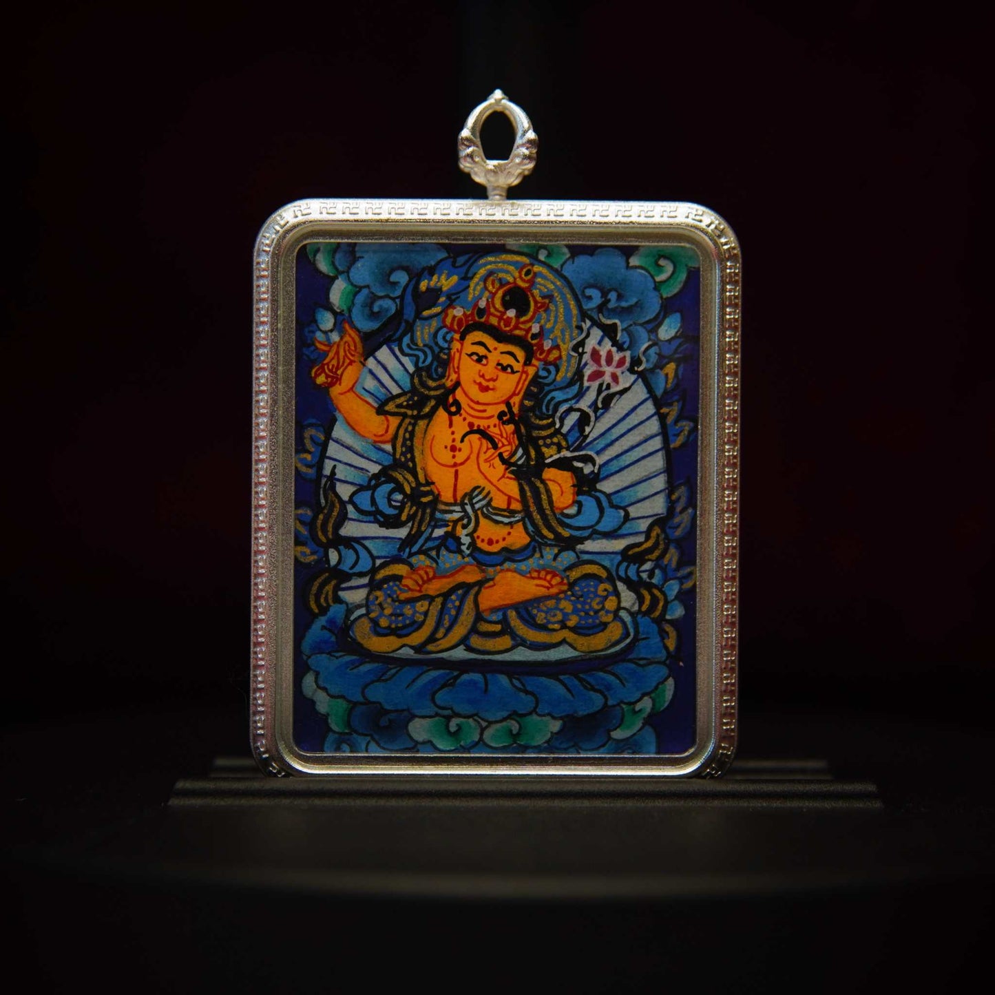 Sacred Wisdom Pendant featuring Manjushri Bodhisattva, handcrafted Thangka jewelry for spiritual growth and wisdom.