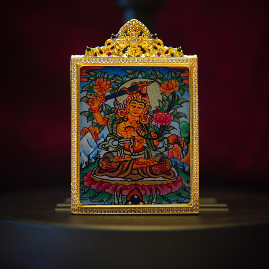 Hand-painted Manjushri necklace featuring sacred Buddhist wisdom amulet with intricate thangka design in gold frame.