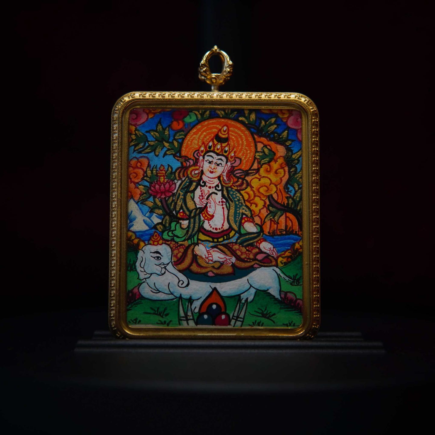 Hand-painted Samantabhadra Bodhisattva Thangka pendant with ornate gold frame, featuring Bodhisattva on a white elephant, symbolizing compassion and wisdom.