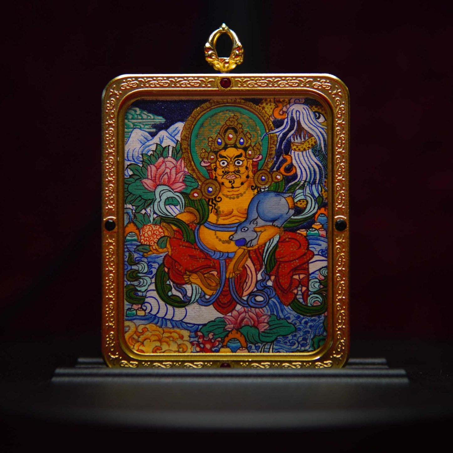 Authentic hand-painted Yellow Jambhala Thangka pendant with gold-toned frame, symbolizing fortune and prosperity.