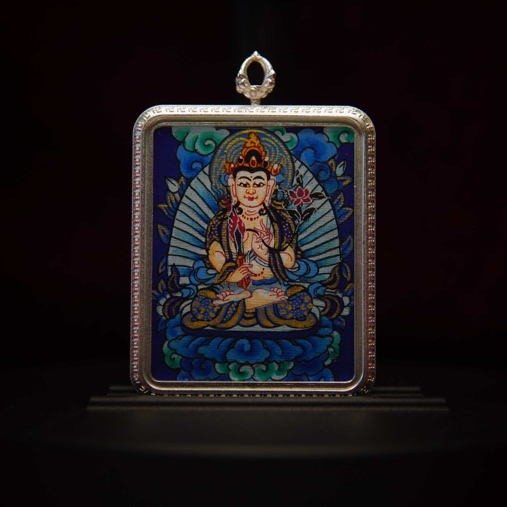 Akasagarbha Bodhisattva Thangka Pendant Necklace featuring hand-painted divine imagery of Bodhisattva with ornate adornments, surrounded by cosmic motifs, set in a silver-toned frame.