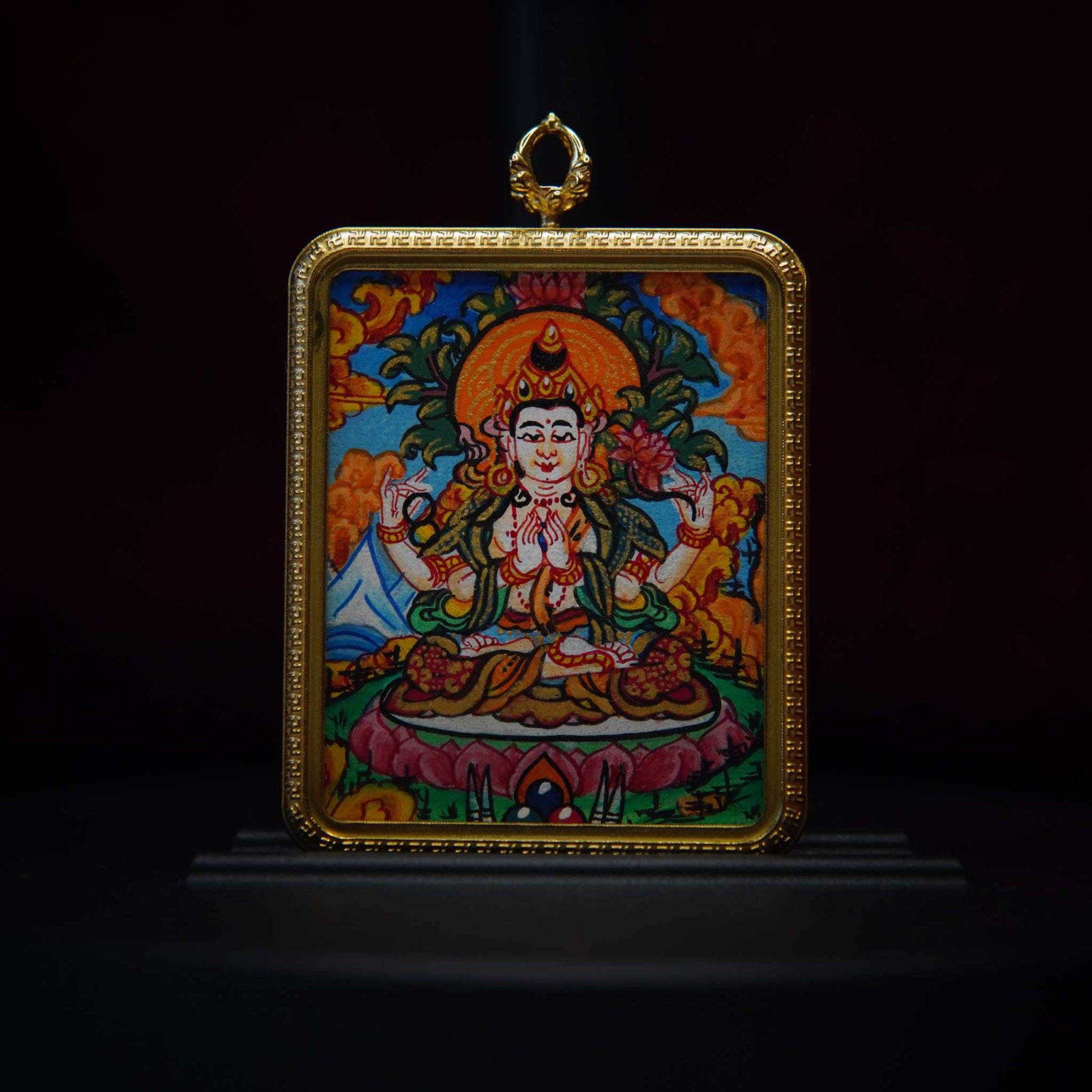 Hand-painted Four-Armed Avalokiteshvara necklace with Tibetan Buddhist pendant, symbolizing compassion and blessings.