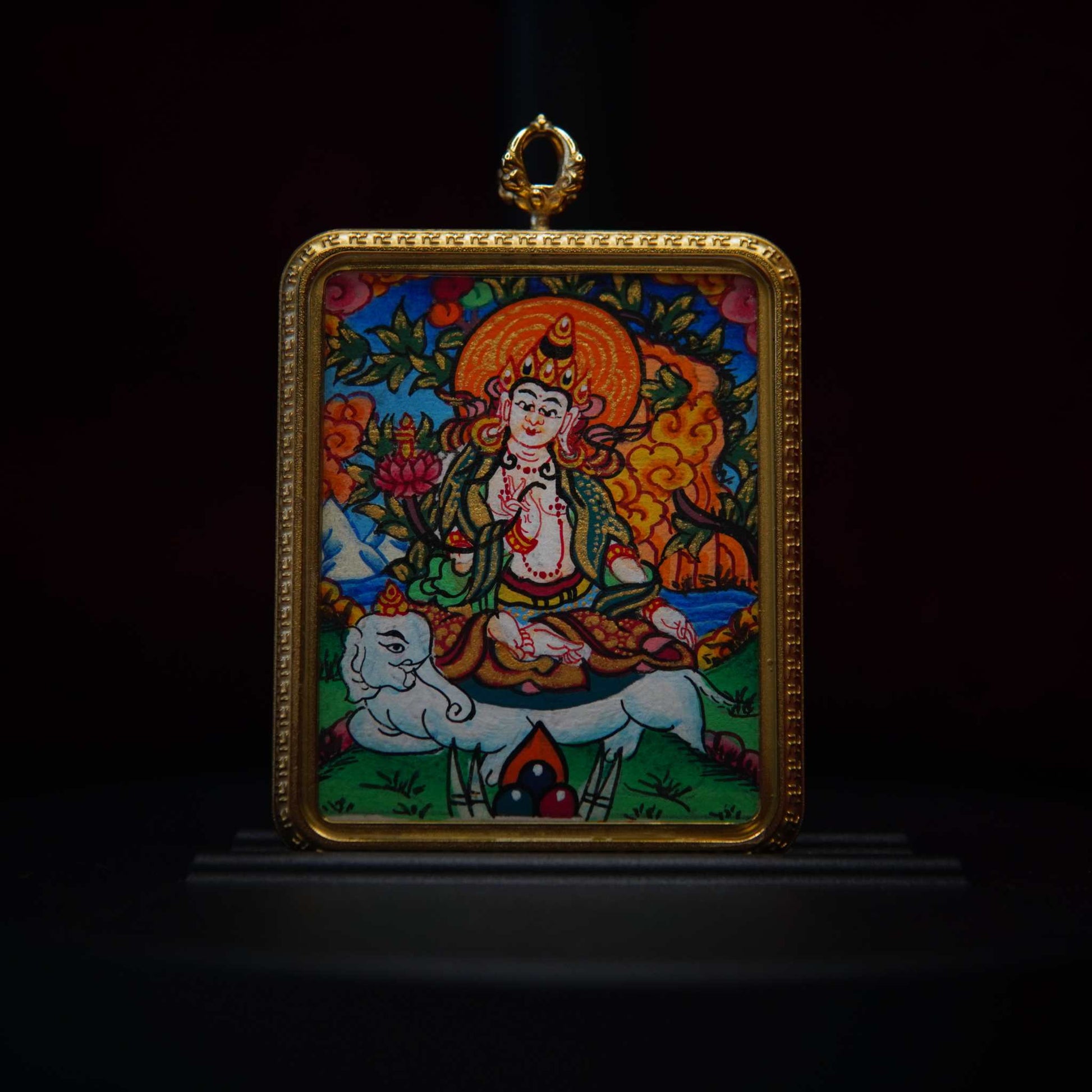 Hand-painted Samantabhadra Bodhisattva Thangka pendant with ornate gold frame, featuring Bodhisattva on a white elephant, symbolizing compassion and wisdom.
